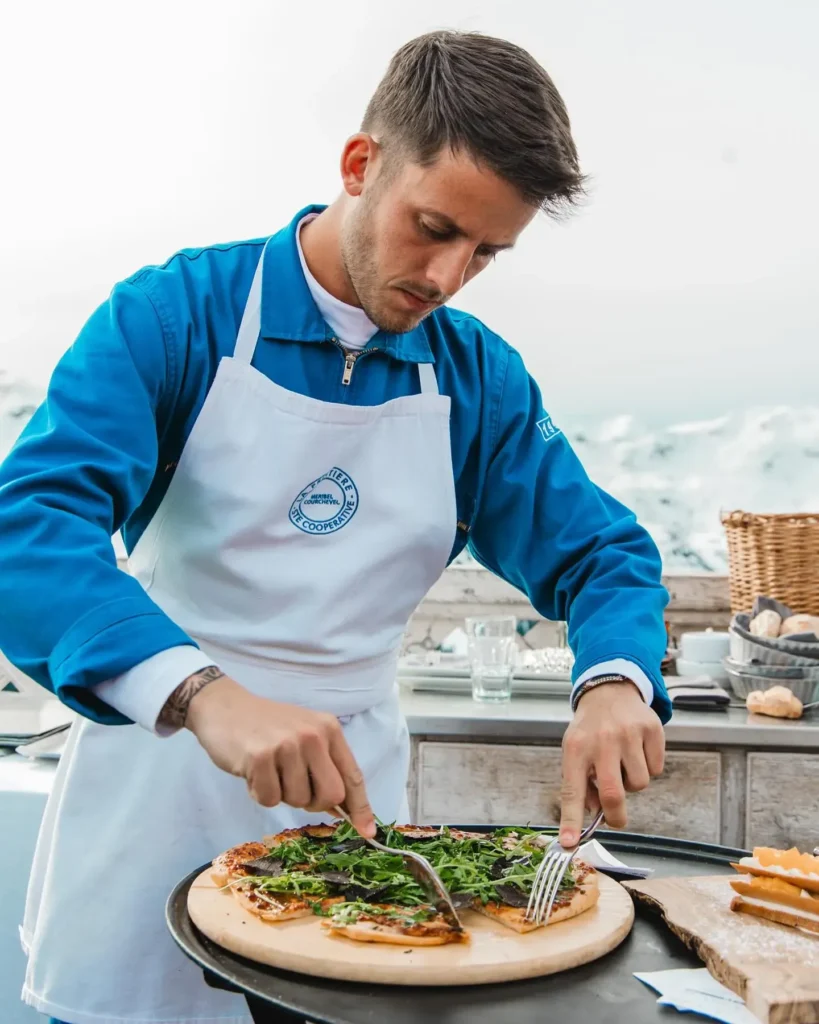Chef preparing a dish at La Folie Douce Méribel