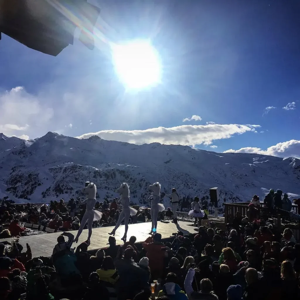 Crowd enjoying a mountain party at La Folie Douce Méribel