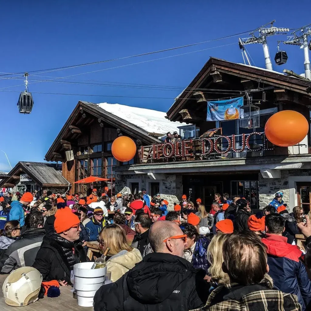 Crowd enjoying an outdoor party at La Folie Douce Méribel