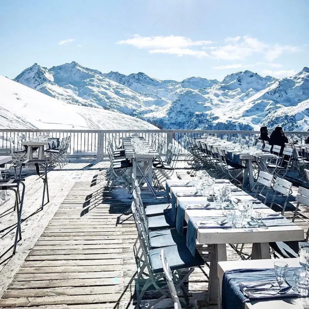 Snow-covered outdoor terrace at La Folie Douce Méribel