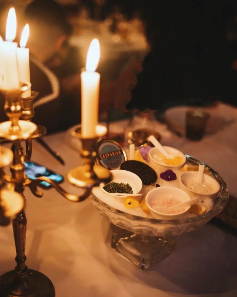 Dessert selection and candlelit table setting at La Mangeoire Courchevel