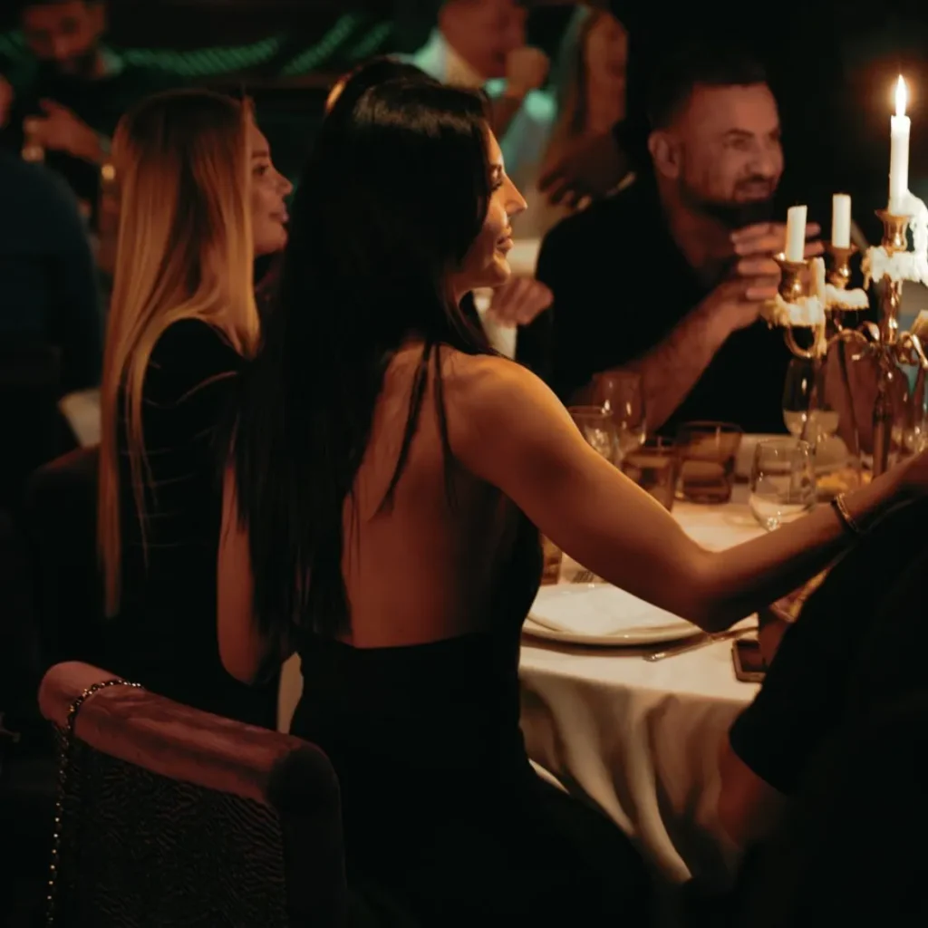 Guests enjoying a candlelit dining experience at La Mangeoire Courchevel