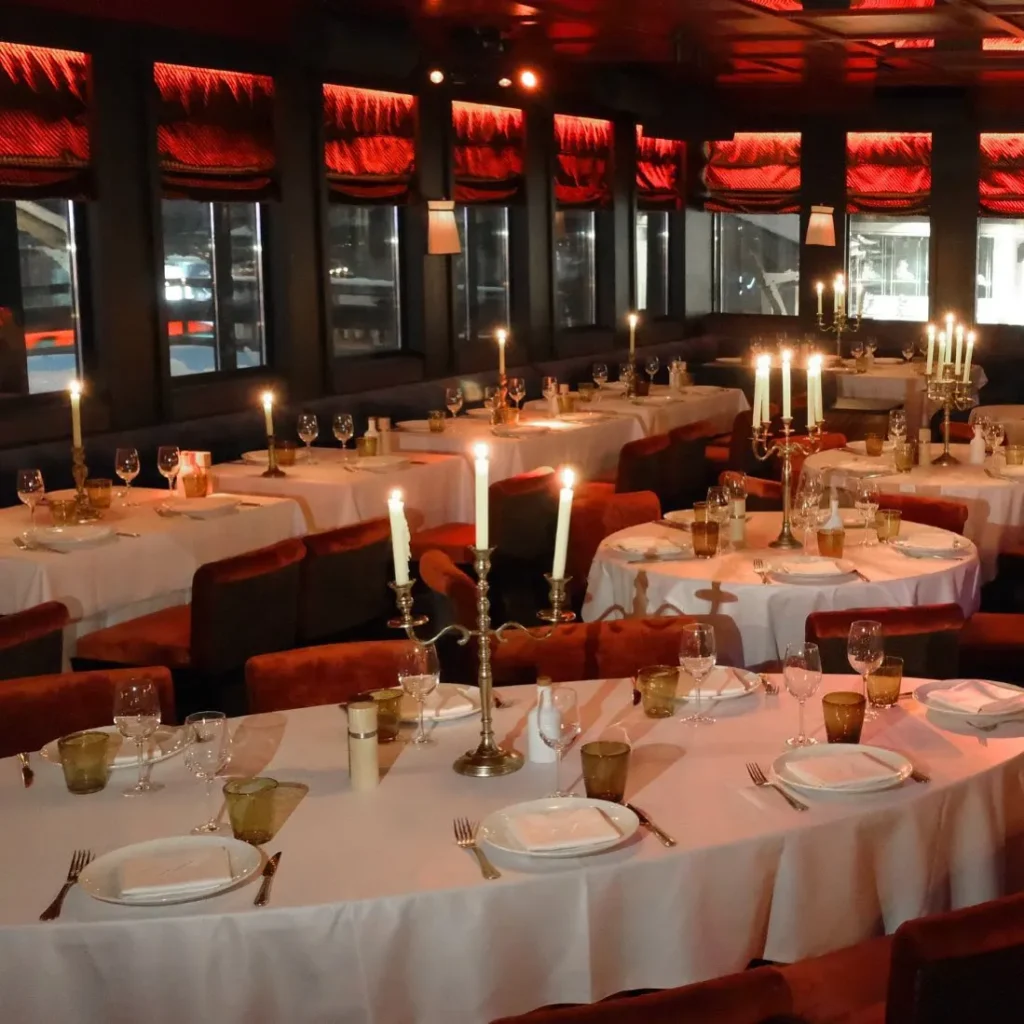 Elegant dining room with candlelit tables at La Mangeoire Courchevel