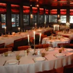 Elegant dining room with candlelit tables at La Mangeoire Courchevel