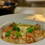 Gourmet seafood dish served at La Mangeoire Courchevel