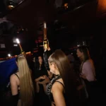 Guests enjoying the vibrant evening atmosphere at La Mangeoire Courchevel