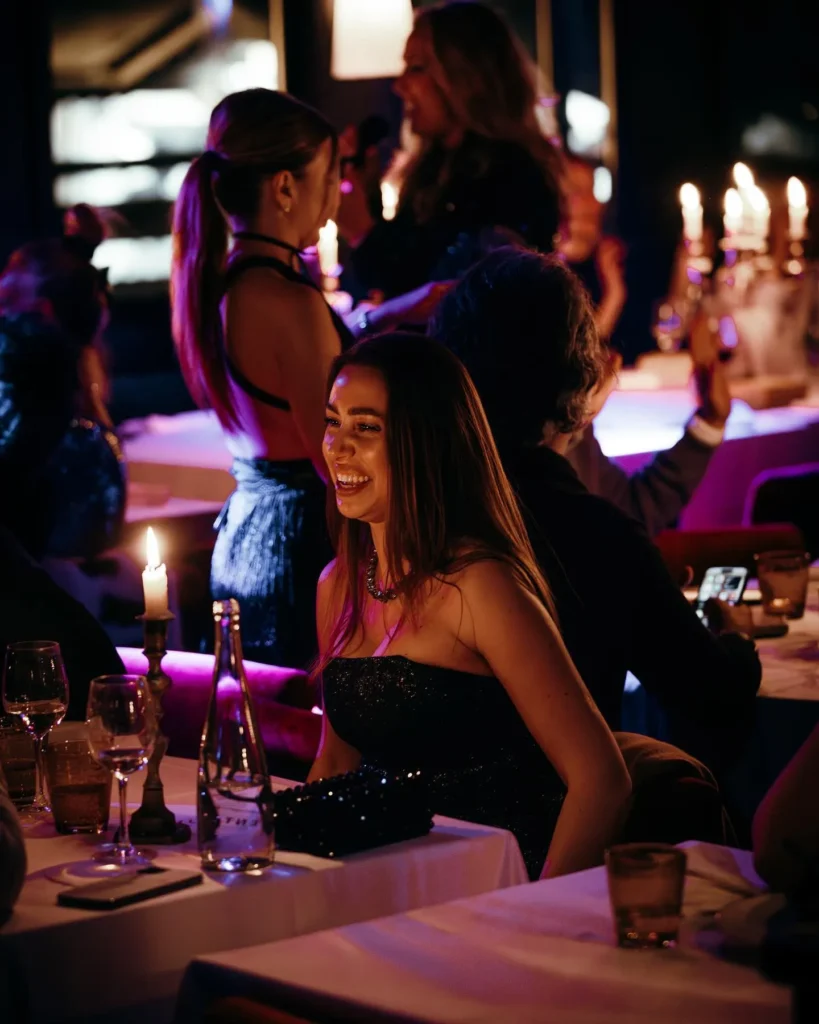 Guests enjoying the lively nightlife atmosphere at La Mangeoire Courchevel