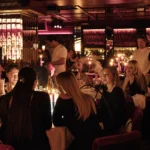 Elegant restaurant interior and candlelit tables at La Mangeoire Courchevel