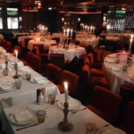 Luxurious restaurant interior with white tablecloths at La Mangeoire Courchevel