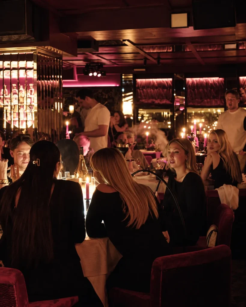 Elegant restaurant interior and candlelit tables at La Mangeoire Courchevel