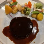 Gourmet beef dish with vegetables served at La Saulire Courchevel