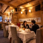 Guests enjoying dinner in the cozy interior of La Saulire Courchevel
