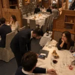 Guests dining in the rustic interior of La Saulire Courchevel