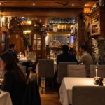 Candlelit dining room with guests at La Saulire Courchevel