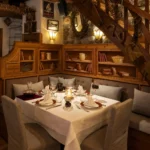 Elegant dining table and rustic wood interior at La Saulire Courchevel