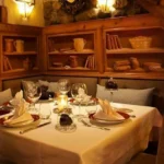 Elegant dining room with rustic alpine decor at La Saulire Courchevel