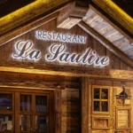 Wooden entrance to La Saulire restaurant in Courchevel