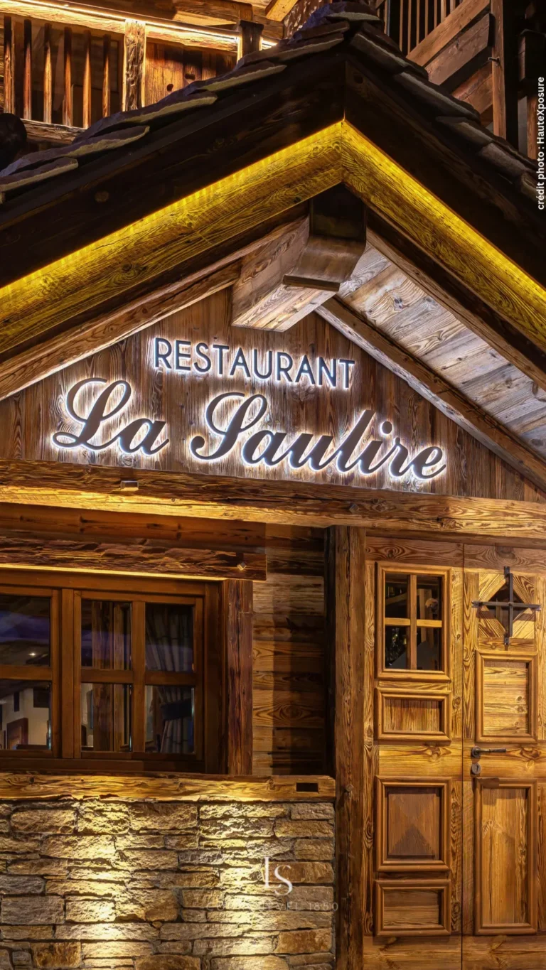 Wooden entrance to La Saulire restaurant in Courchevel