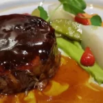 Gourmet beef dish with vegetables and sauce at La Saulire Courchevel