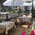Outdoor dining terrace with umbrellas at La Saulire Courchevel
