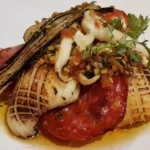 Gourmet seafood dish with vegetables served at La Saulire Courchevel