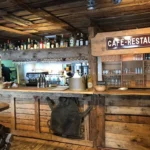 Wooden bar counter inside La Soucoupe Courchevel
