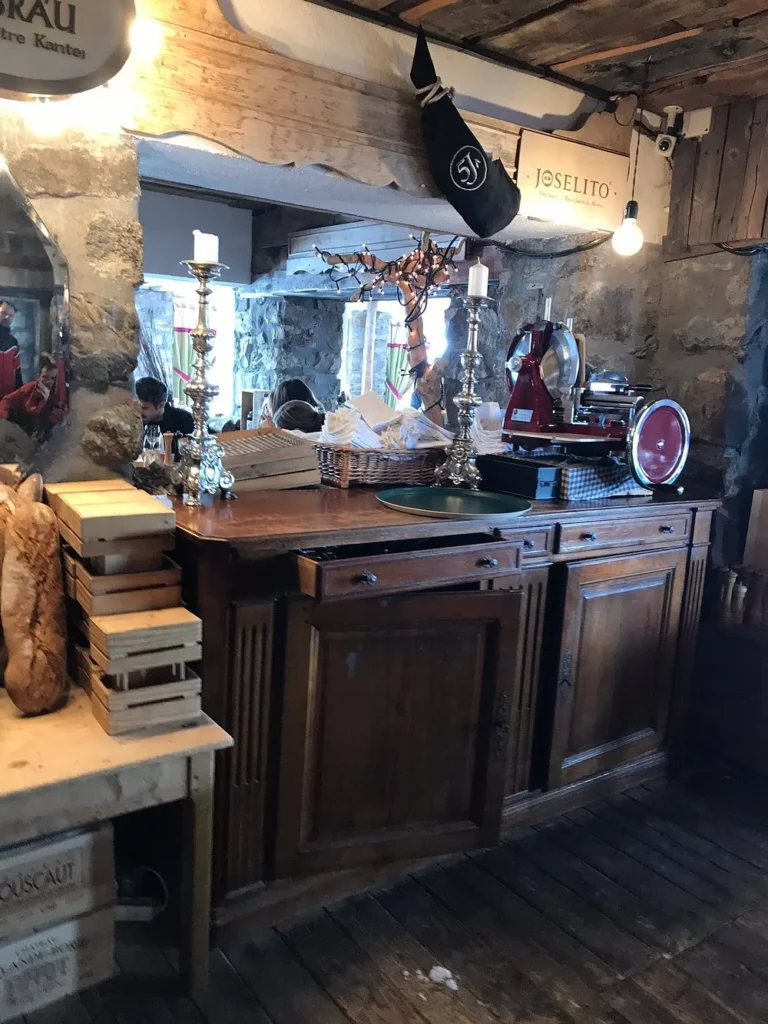 Rustic wooden bar and restaurant interior at La Soucoupe Courchevel