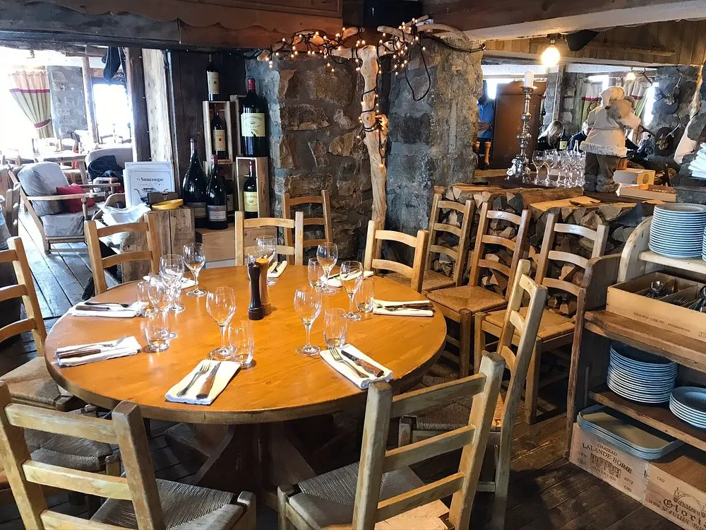 Wooden dining area with rustic alpine decor at La Soucoupe Courchevel