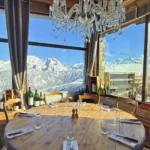 Elegant dining room with panoramic mountain views at La Soucoupe Courchevel