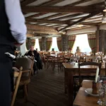 Spacious dining room with alpine views at La Soucoupe Courchevel