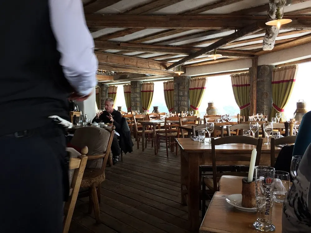 Spacious dining room with alpine views at La Soucoupe Courchevel