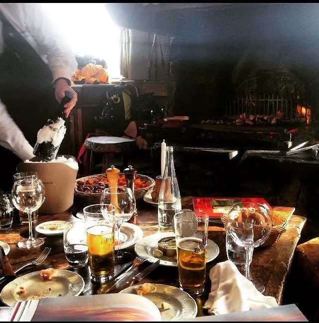 Gourmet dinner with wine served at La Soucoupe Courchevel