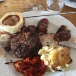 Gourmet meat and side dishes served at La Soucoupe Courchevel