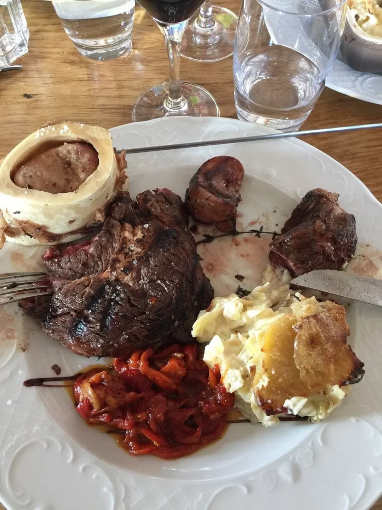 Gourmet meat and side dishes served at La Soucoupe Courchevel