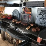 Open fire grill cooking at La Soucoupe Courchevel