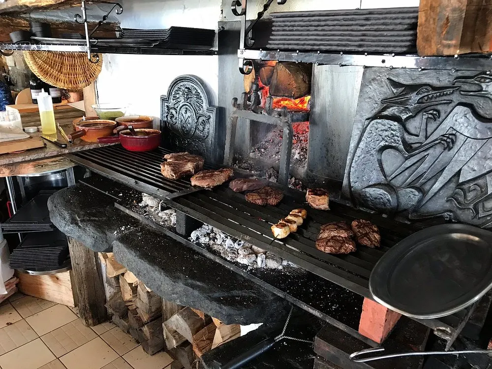 Open fire grill cooking at La Soucoupe Courchevel