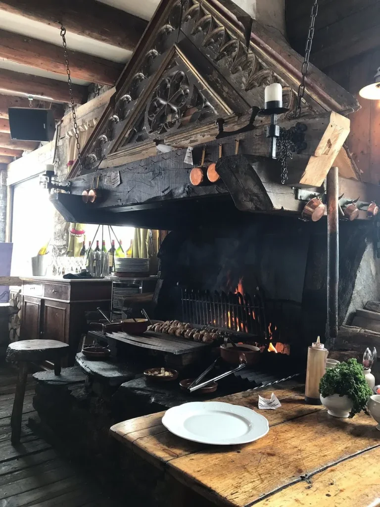 Open kitchen and fire grill inside La Soucoupe Courchevel