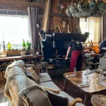Cozy restaurant interior with alpine decor at La Soucoupe Courchevel
