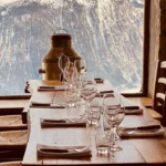 Snow-covered ski slopes surrounding La Soucoupe Courchevel