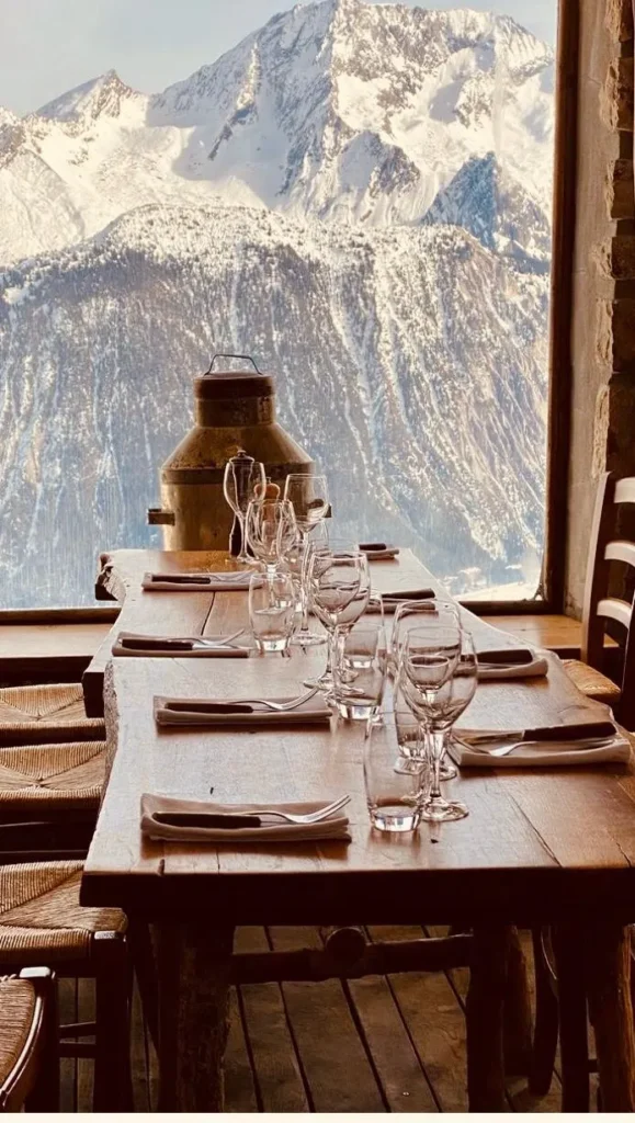 Snow-covered ski slopes surrounding La Soucoupe Courchevel