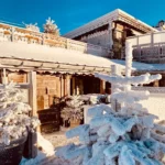 Snow-covered exterior and terrace of La Soucoupe Courchevel