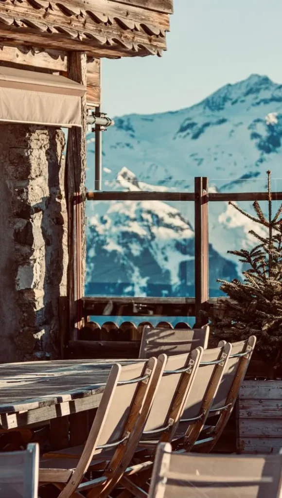 Outdoor terrace with mountain views at La Soucoupe Courchevel