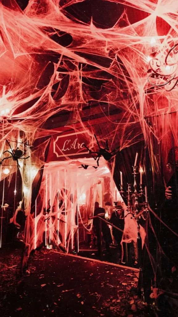 Dramatic red-lit interior at L'Arc Paris nightclub