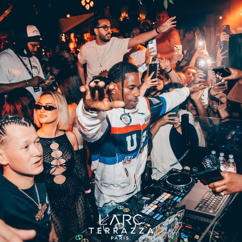 DJ performing to a crowd at L'Arc Paris