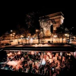 L'Arc Paris nightclub exterior illuminated at night