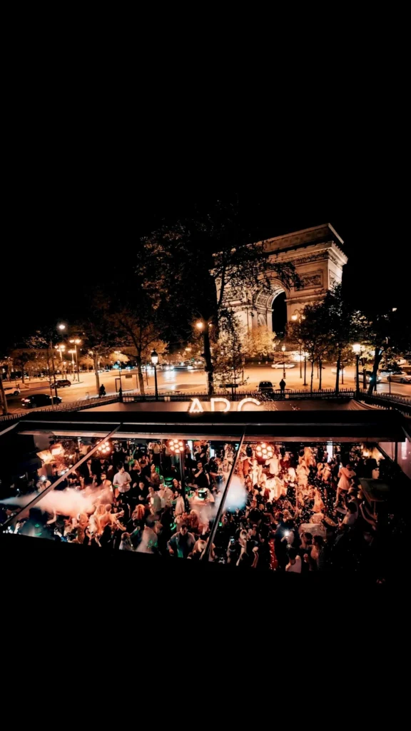 L'Arc Paris nightclub exterior illuminated at night