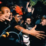 Crowd enjoying the vibrant atmosphere at L'Arc Paris