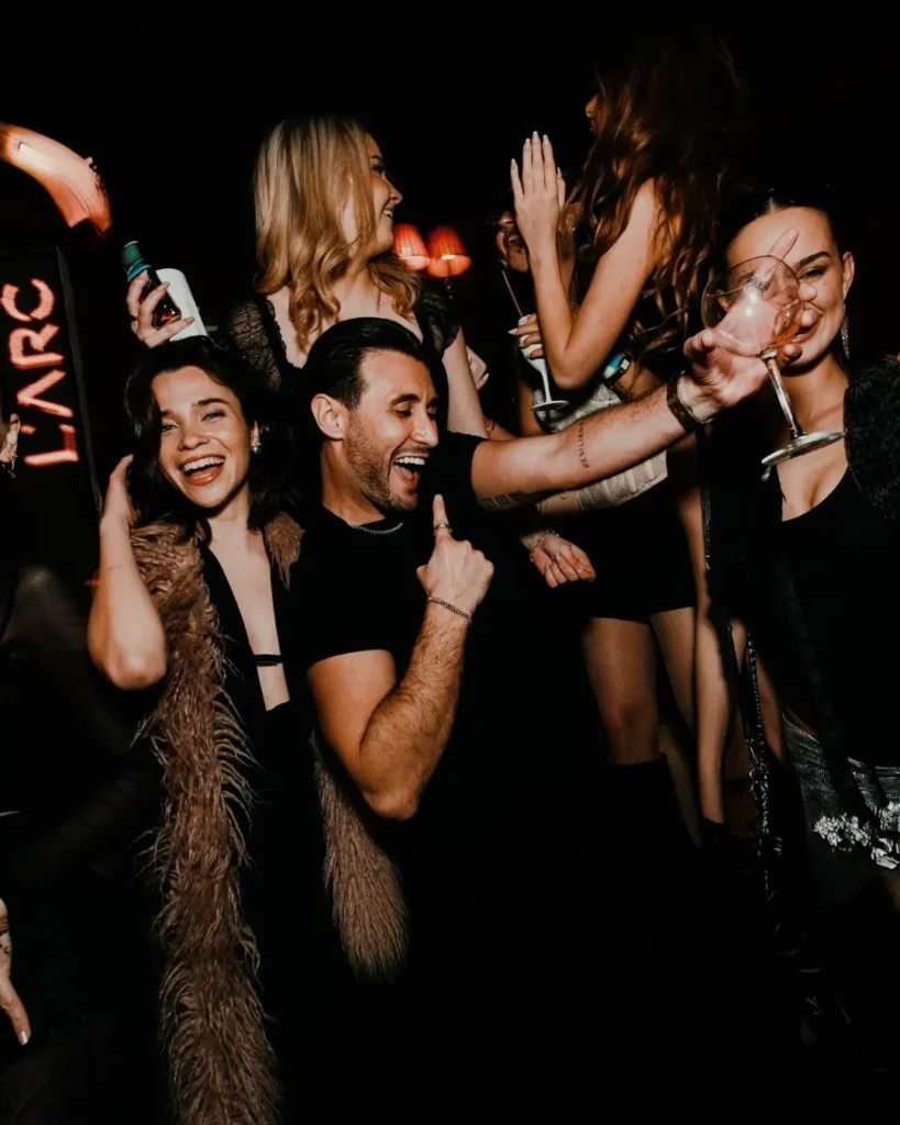 Guests celebrating together at L'Arc Paris