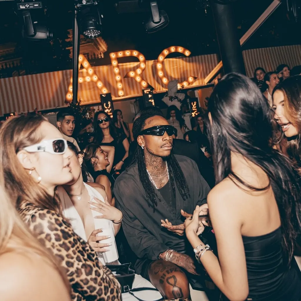 Guests enjoying the nightlife atmosphere inside L'Arc Paris