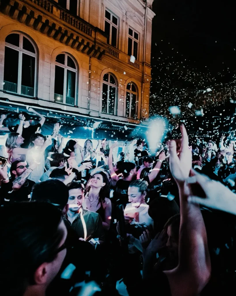 Crowd enjoying a lively night at L'Arc Paris